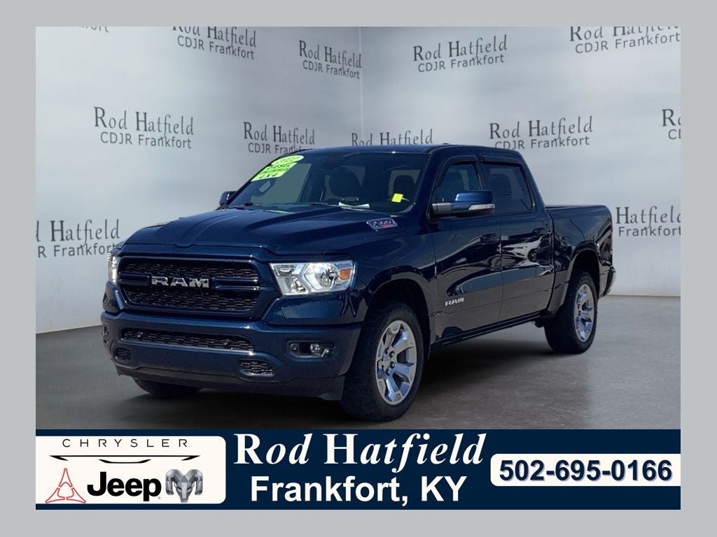 2022 RAM 1500 Big Horn Crew Cab 4x4 5'7' Box in Patriot Blue Pearlcoat — front three-quarter view