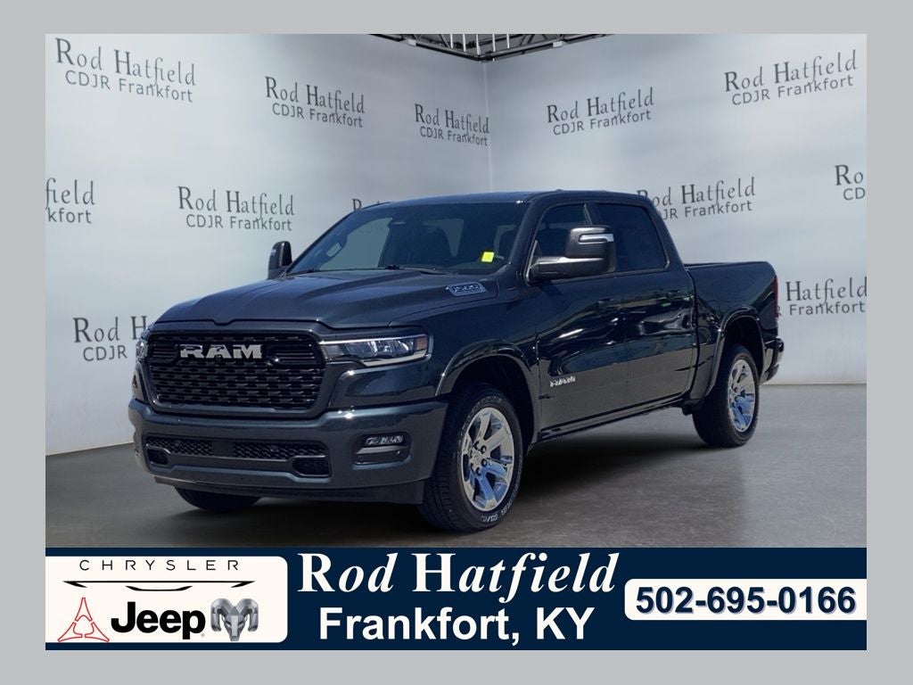 2026 RAM Ram 1500 RAM 1500 BIG HORN CREW CAB 4X4 5'7' BOX in Forged Blue Metallic Exterior Paint — front three-quarter view