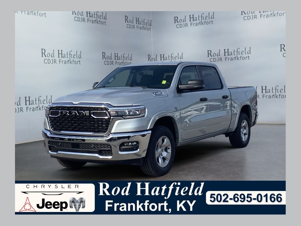 2026 RAM Ram 1500 RAM 1500 BIG HORN CREW CAB 4X4 5'7' BOX in Silver Zynith Exterior Paint — front three-quarter view