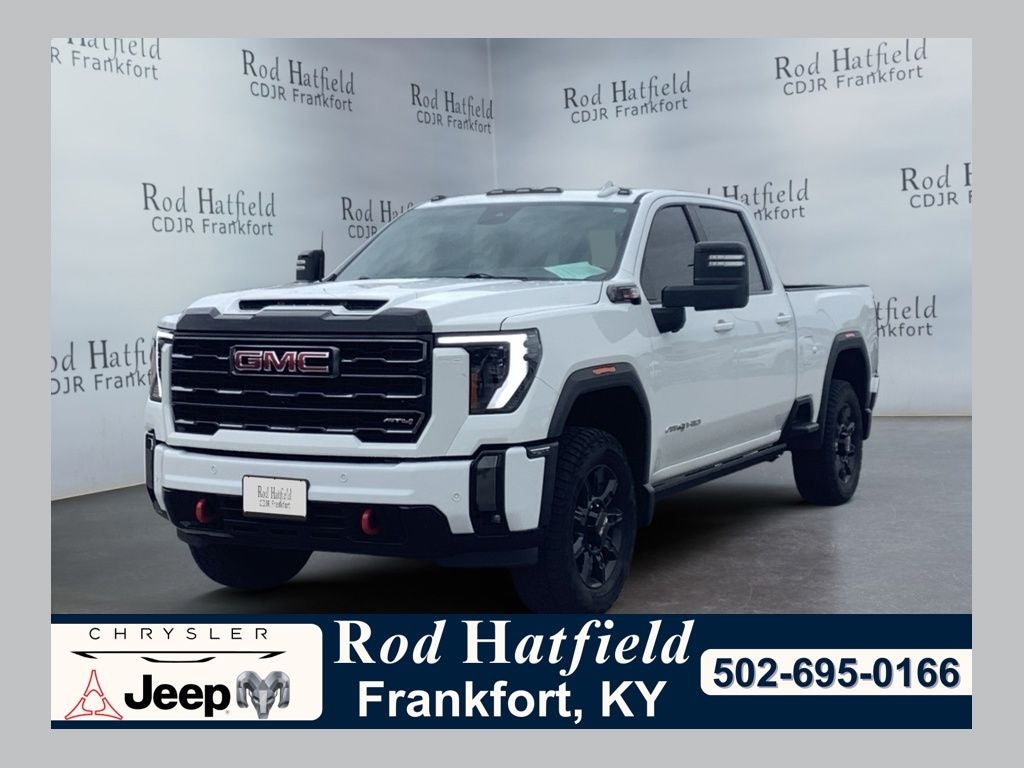 2024 GMC Sierra 2500HD AT4 in Summit White — front three-quarter view
