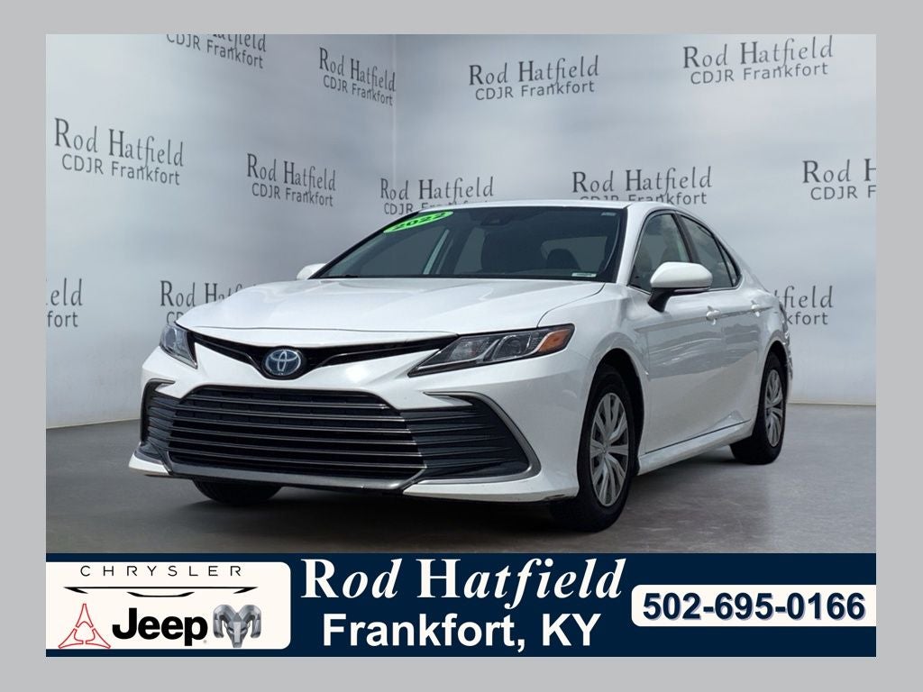 2022 Toyota Camry LE Hybrid in White — front three-quarter view